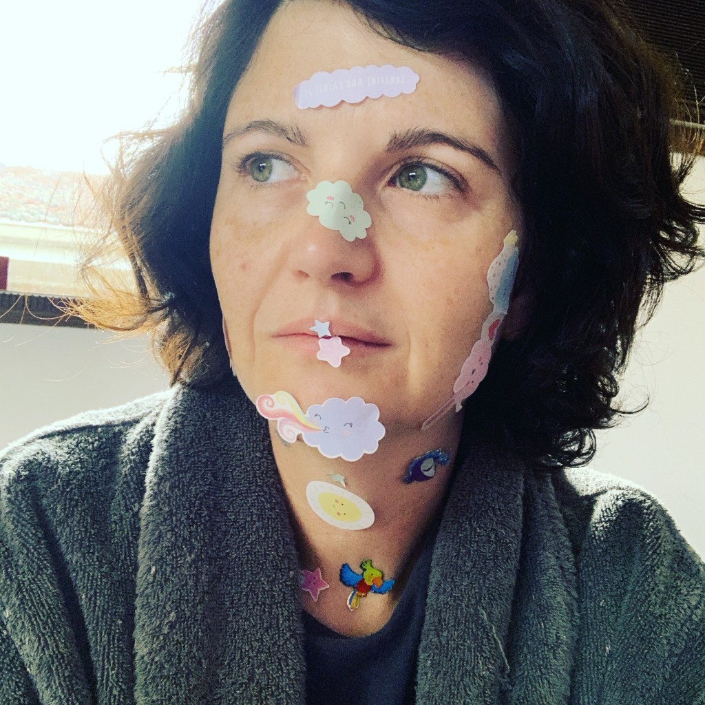 Image of Shelley with stickers on her face